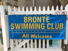 Bronte Swimming Club banner on fence